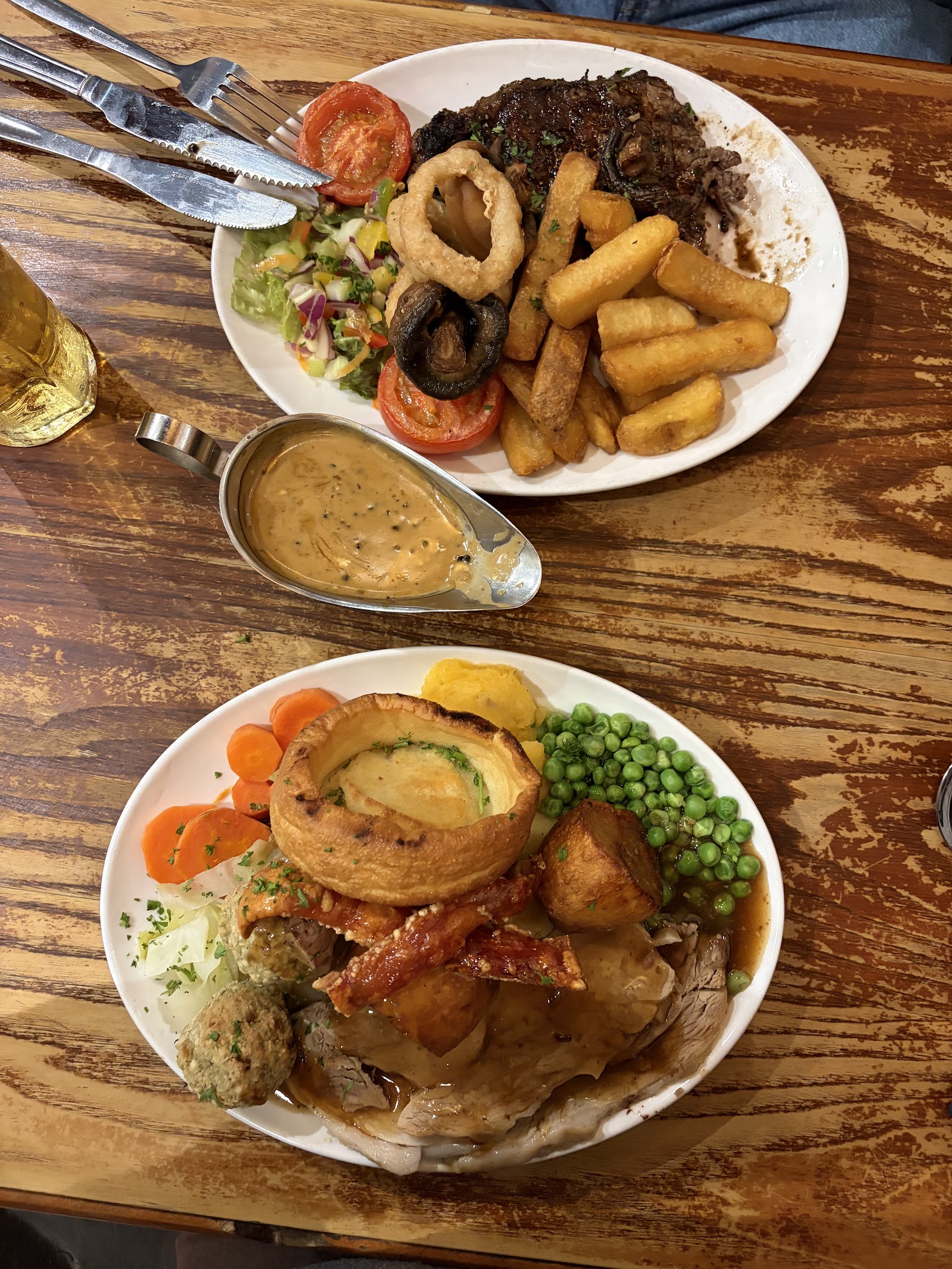 Two plates from the kitchen — the Sunday roast up front