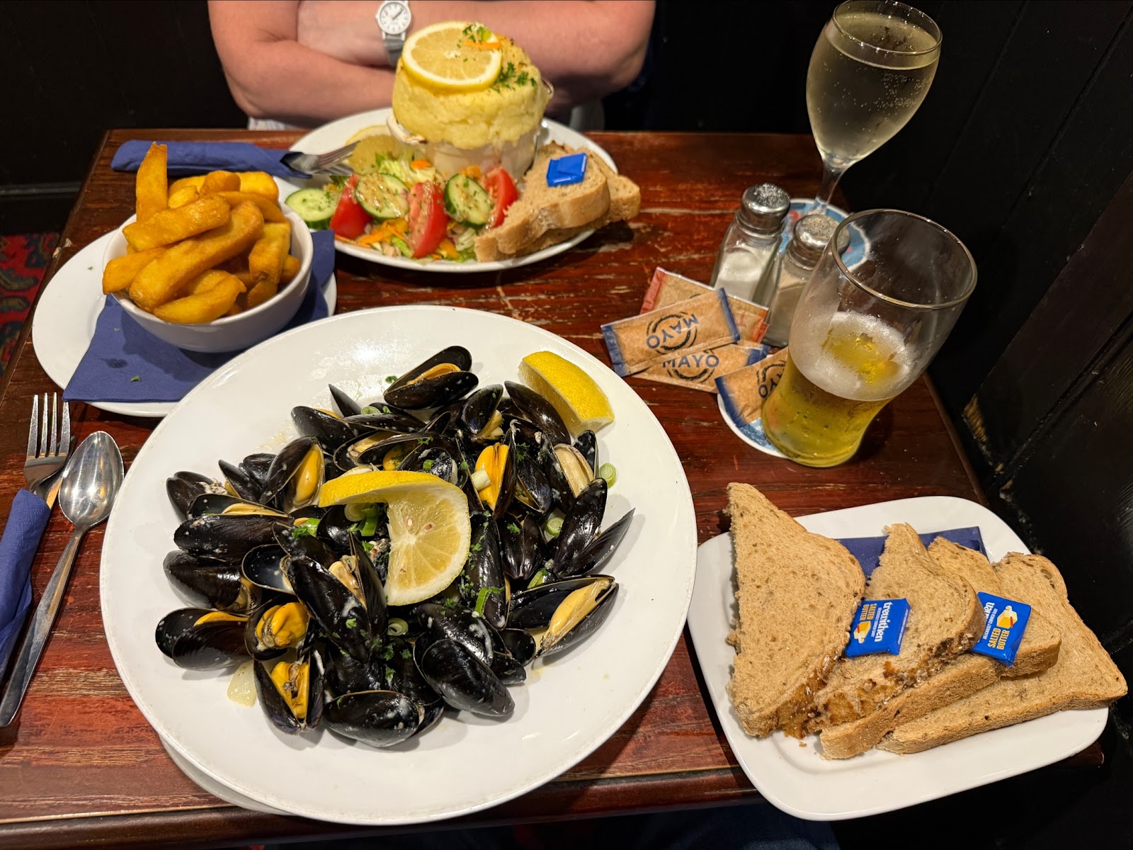 Moules marinière with chunky chips and the fish pie behind